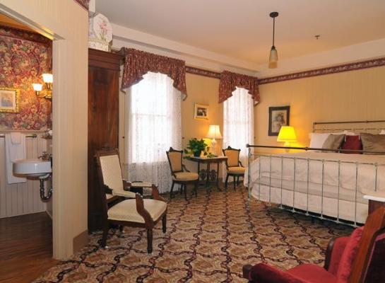 Image of Antique Iron Bed in Victorian Room with Bathroom Atlantic Hotel