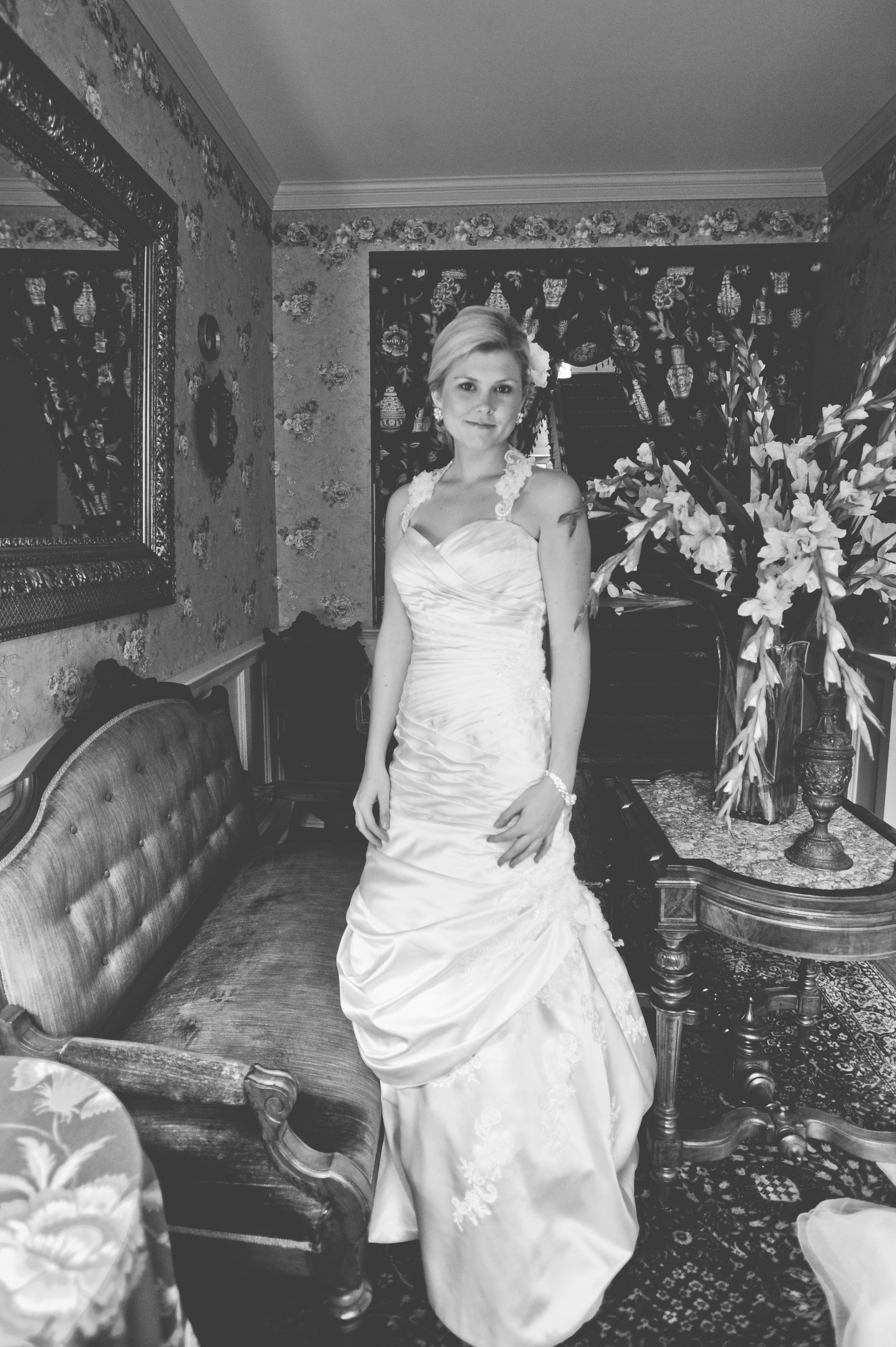 B&W Image of bride standing in long dress in Atlantic Hotel Berlin MD