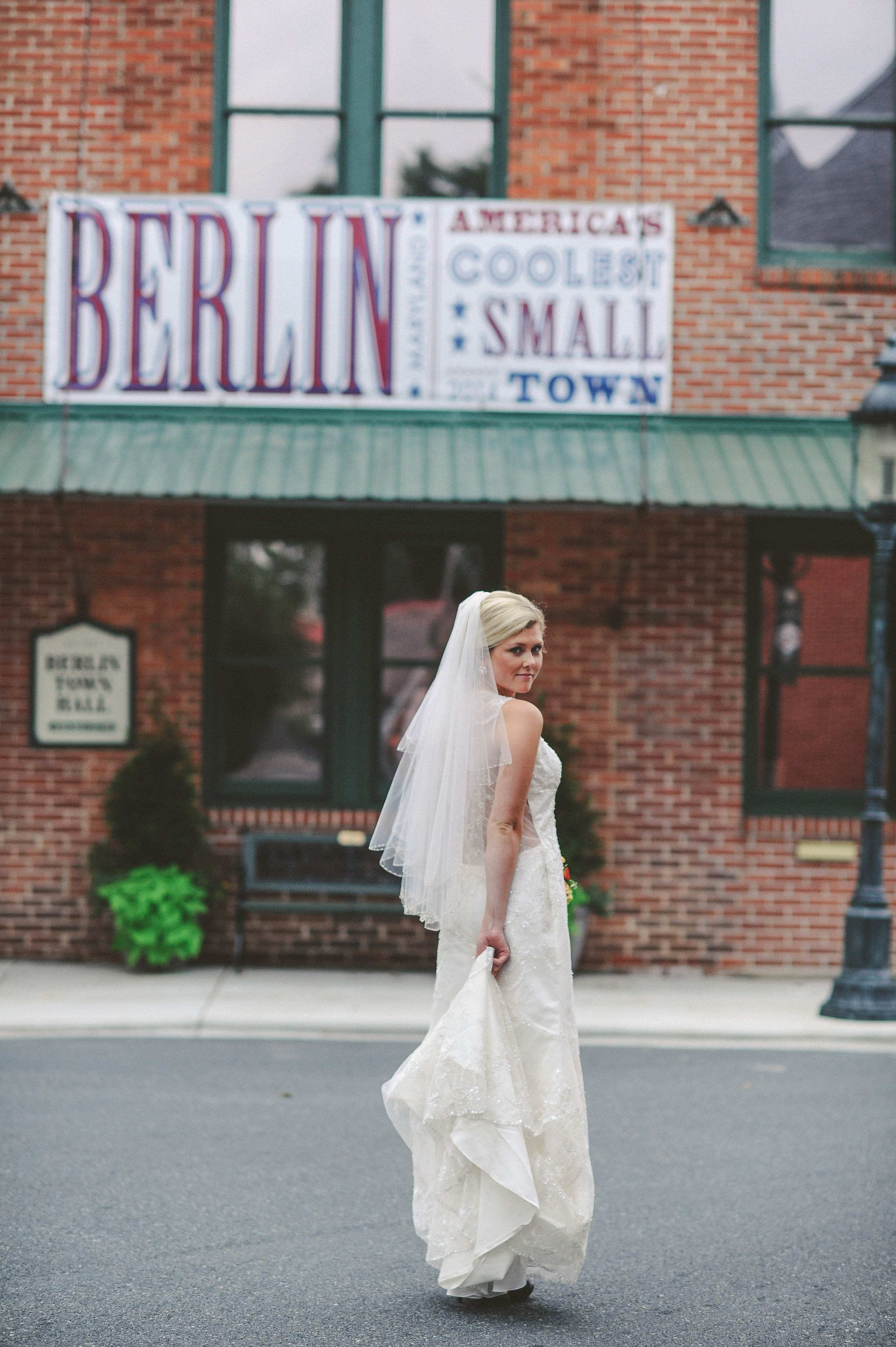 Bride wearing Bustle Bridal Gown on the street of Berlin MD Americas Coolest Small Town
