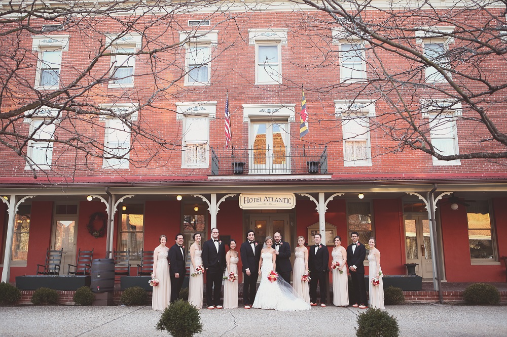 Winter Wedding Party standing in front of the Atlantic Hotel