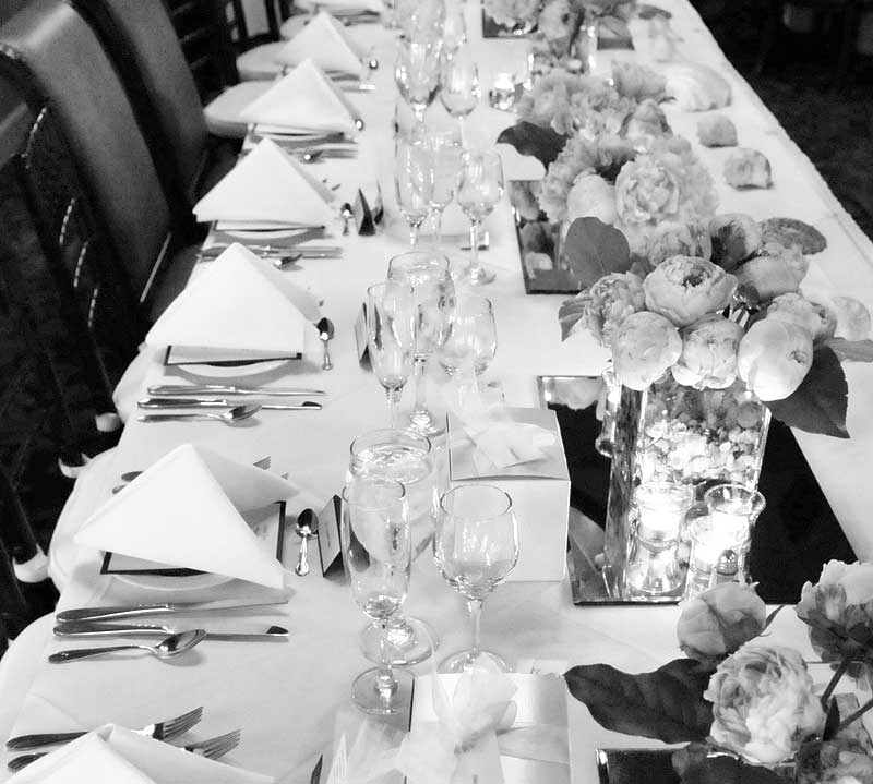 B&W image of head table in Atlantic Hotel Berlin MD peonies and votive candles
